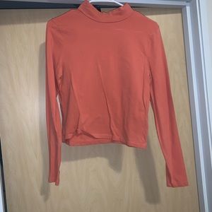 peach turtleneck shirt
